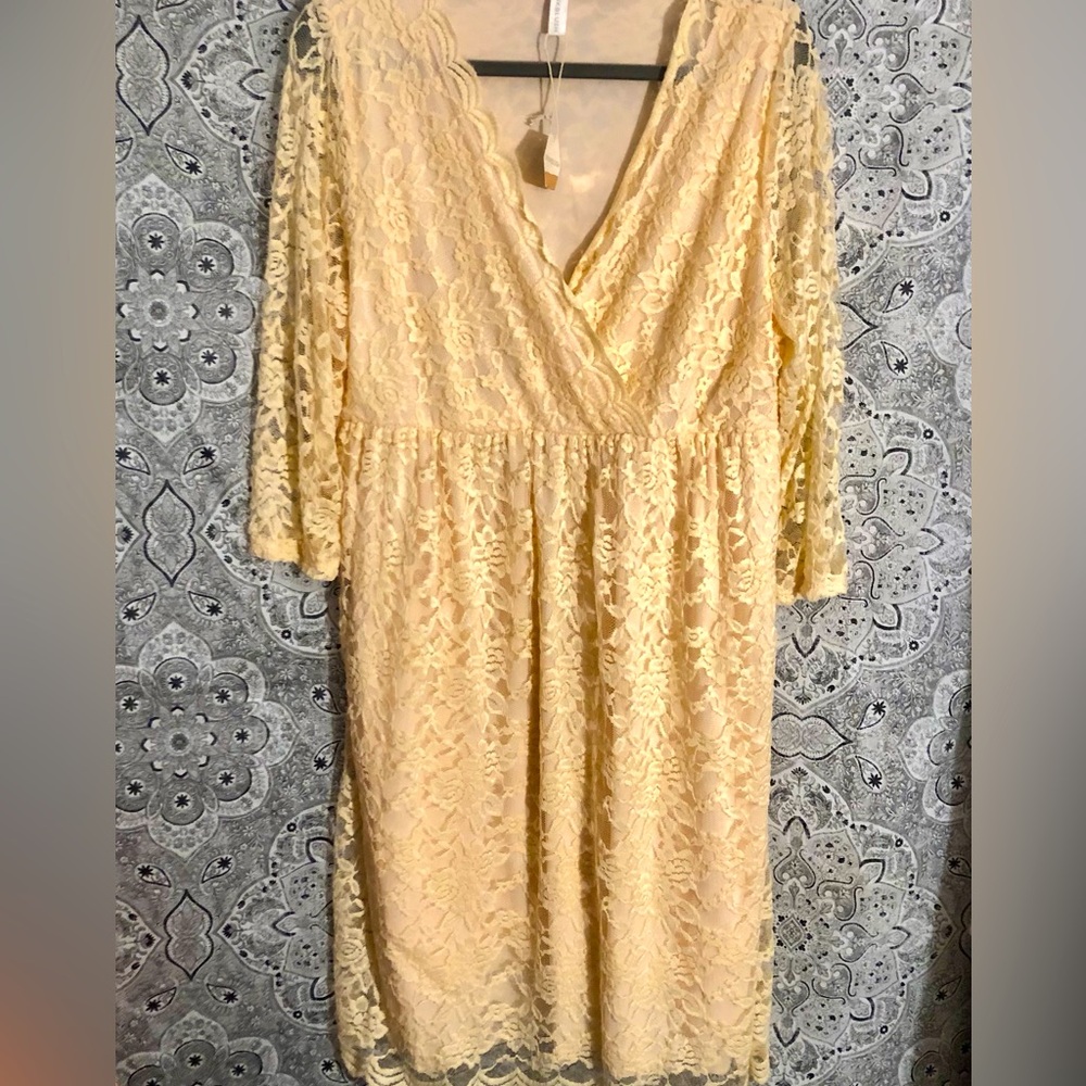 Beautiful peach colored stretch lace maternity wrap dress